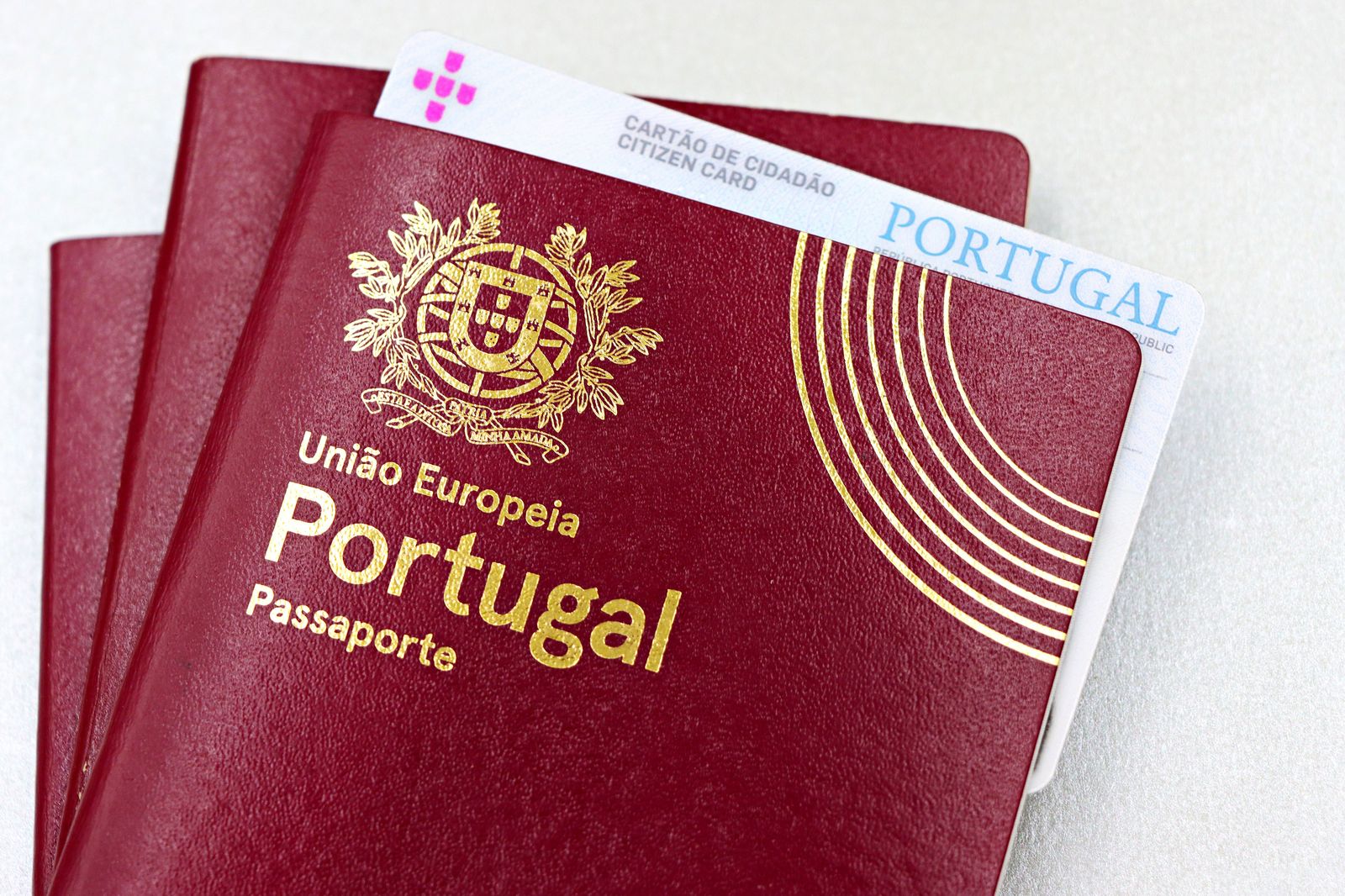 Passports and boarding passes held together before a cross-border trip to the airport