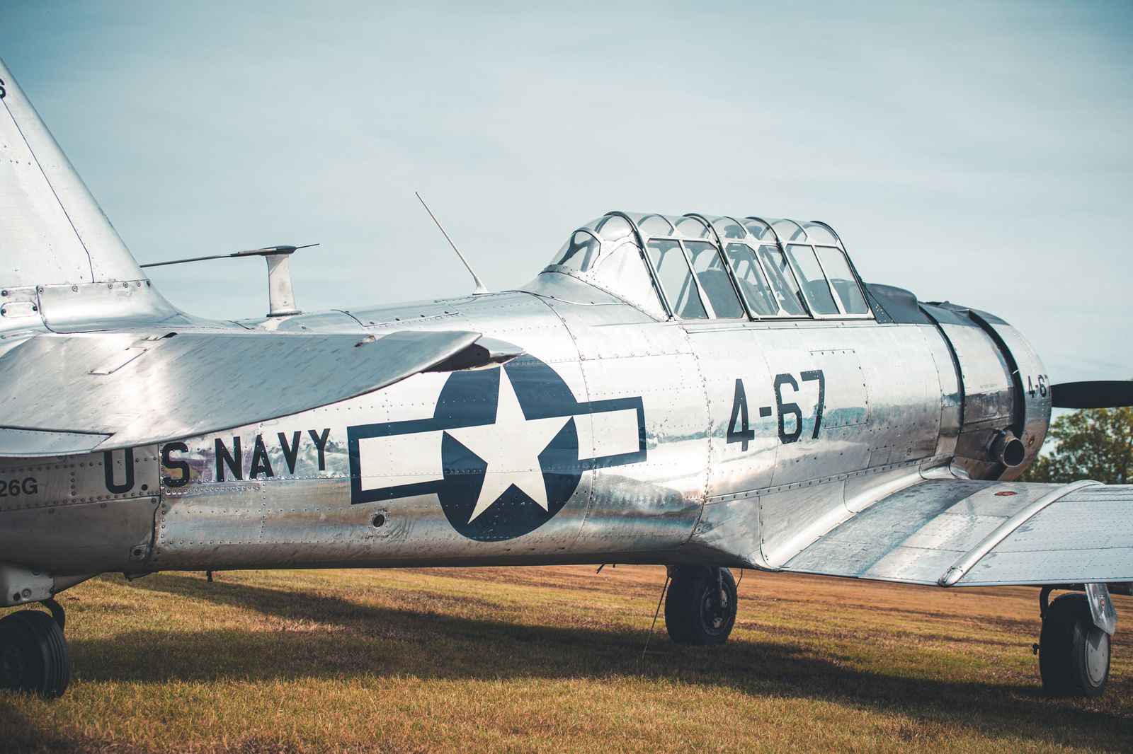 Vintage military aircraft on display inside a museum hangar near Hamilton airport