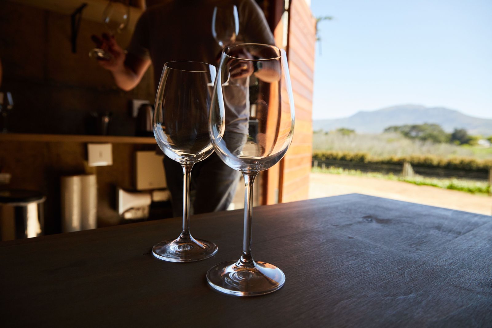 Glasses lined up for a tasting on a winery patio in Niagara wine country