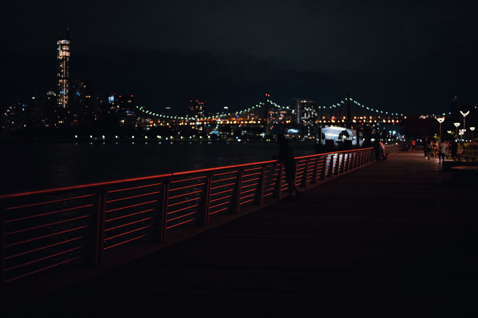 A waterfront boardwalk and park in the evening light, the kind of scene at Hamilton's Pier 8 promenade