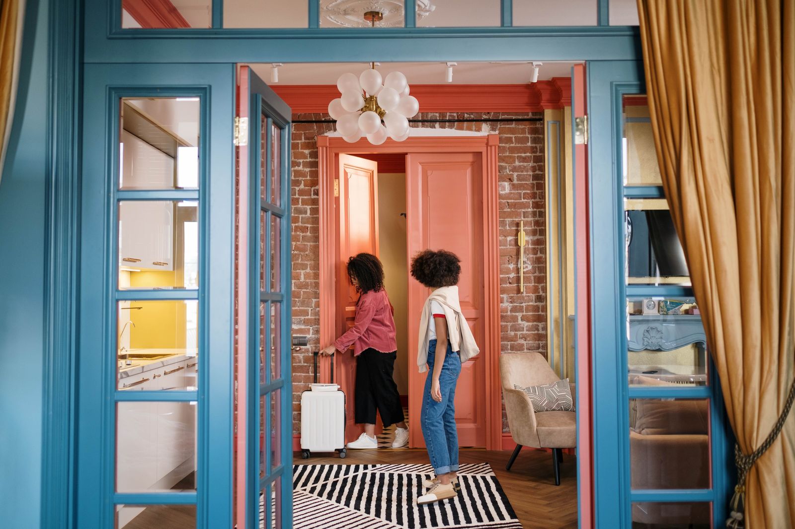 A family's suitcases lined up by the front door before an early departure