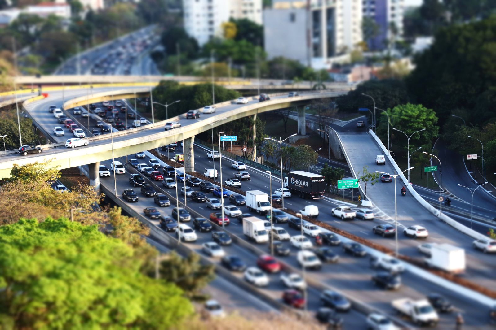 A busy highway interchange in the morning with traffic heading toward the city