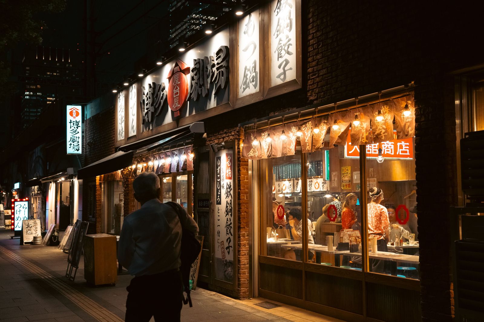 A lit restaurant street at night in Hamilton, a common destination for a Caledonia evening out