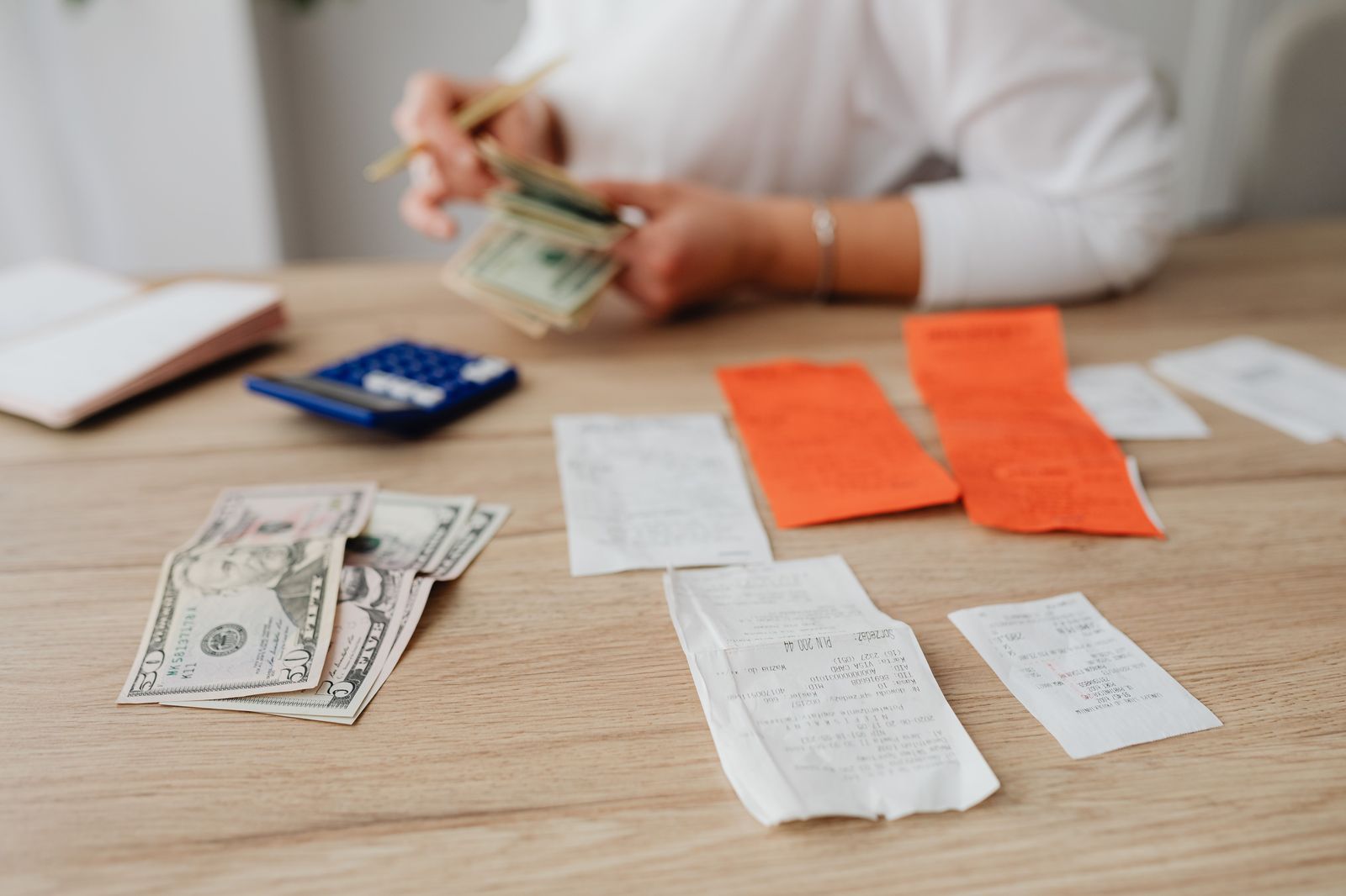 A receipt and calculator, the tools for comparing chauffeur quotes line by line