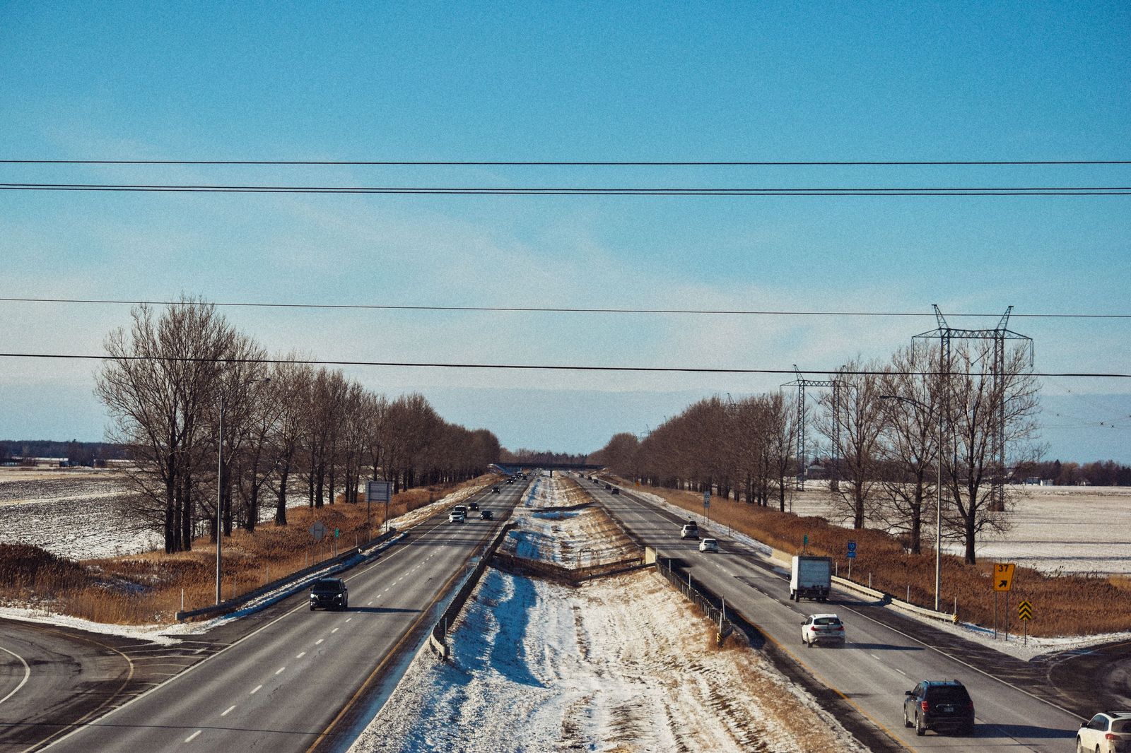 Snow falls on an interstate highway during a lake-effect storm