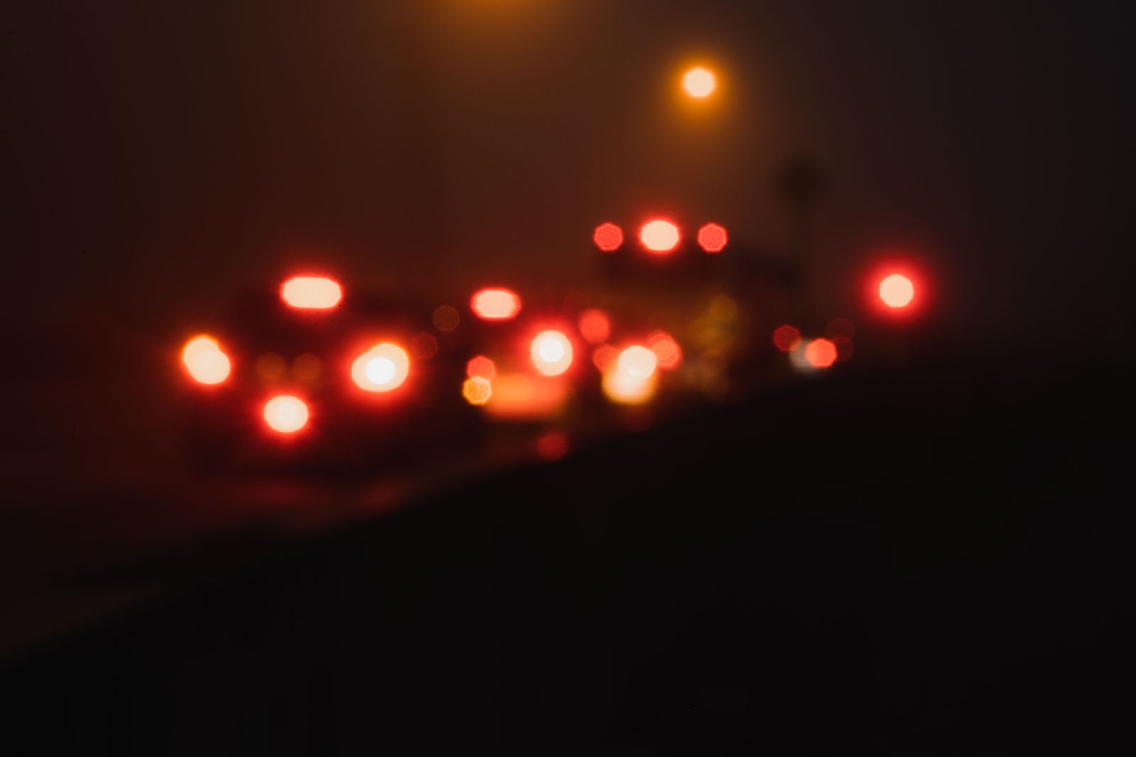 Cars with headlights on a snowy highway, the conditions that add time to the Pearson drive