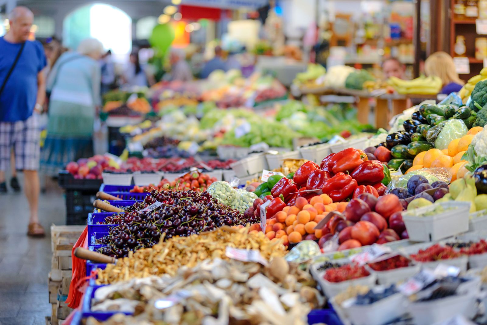 Produce and bakery stalls inside an indoor farmers' market in downtown Hamilton