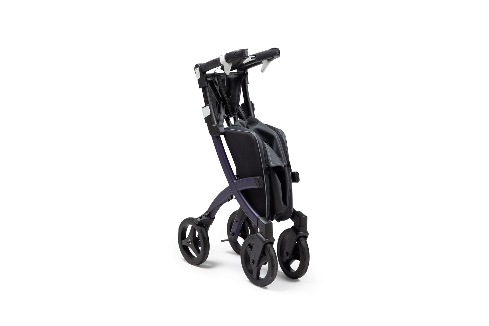 A folding walker stowed in a car trunk before an appointment
