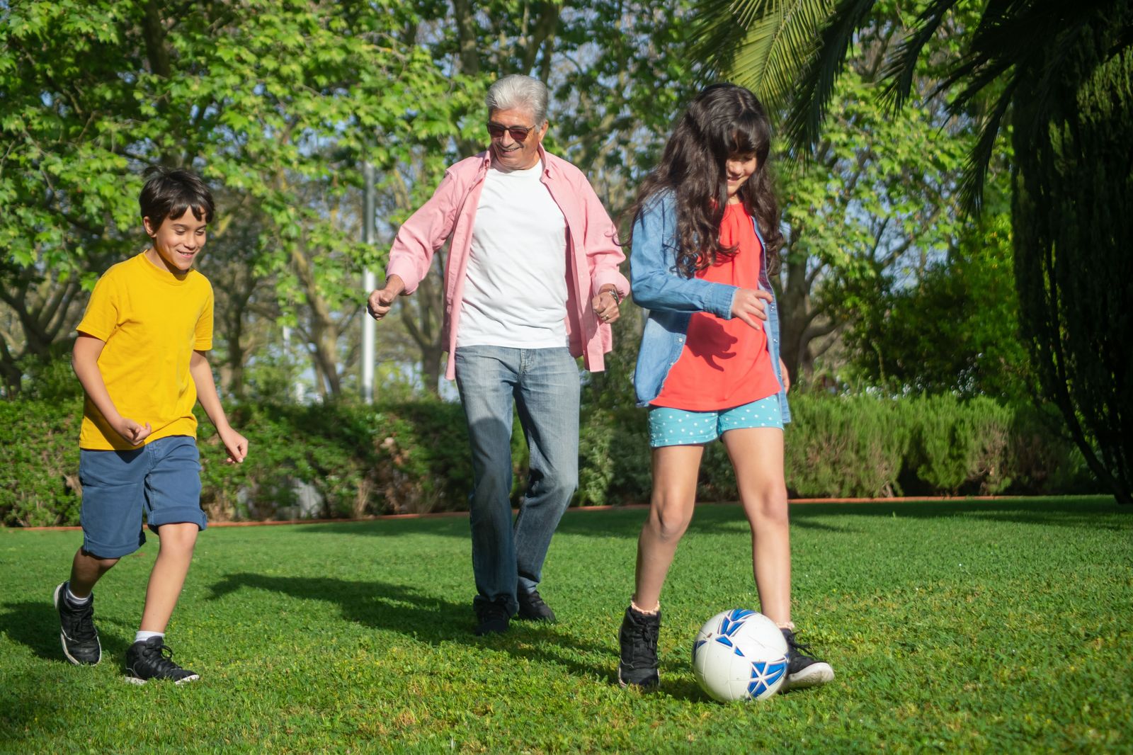Grandparents and grandchildren together at a backyard family gathering