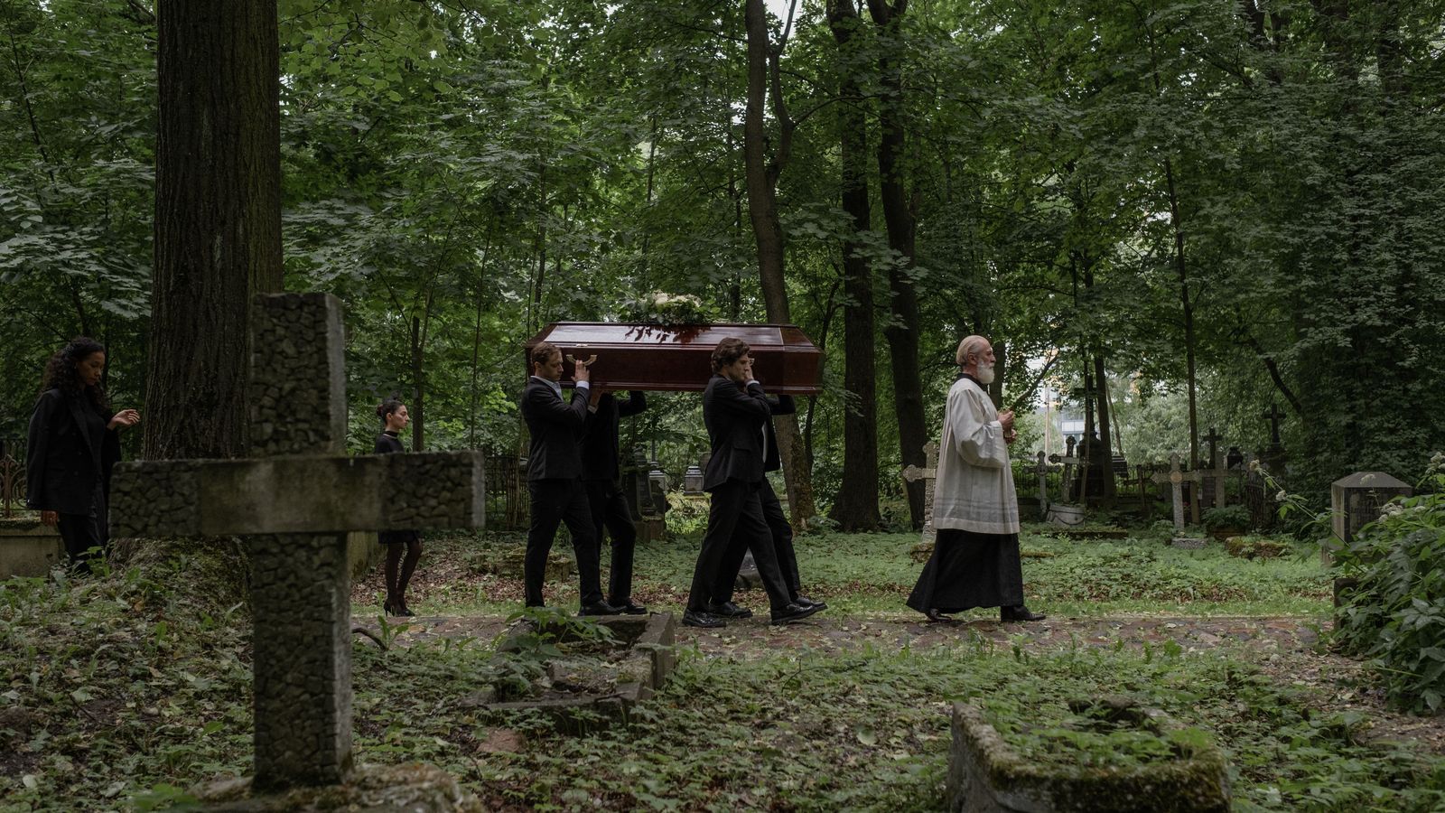 Who rides in the funeral limo