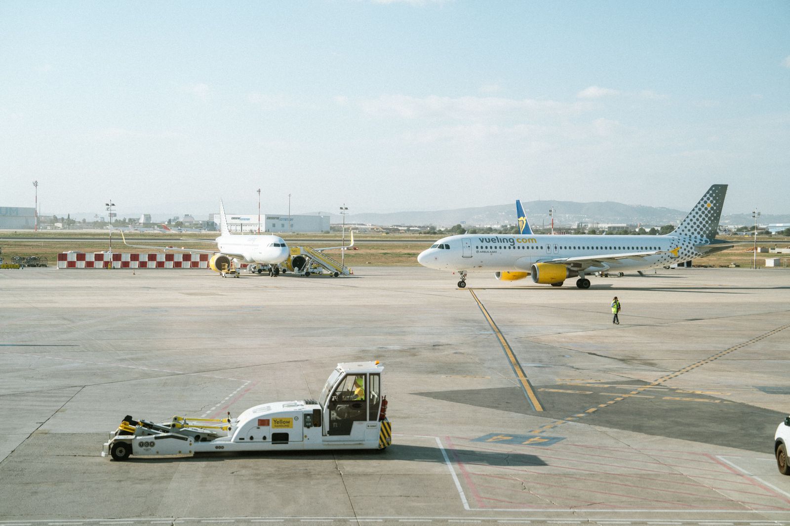 A taxi rank outside an airport terminal; availability on the Georgetown end at 4 a.m. is the real question.