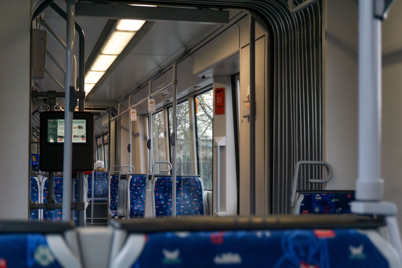 Rows of seats inside a double-decker commuter train carriage