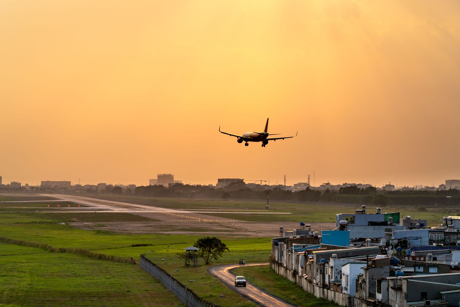 A passenger jet taking off at dusk