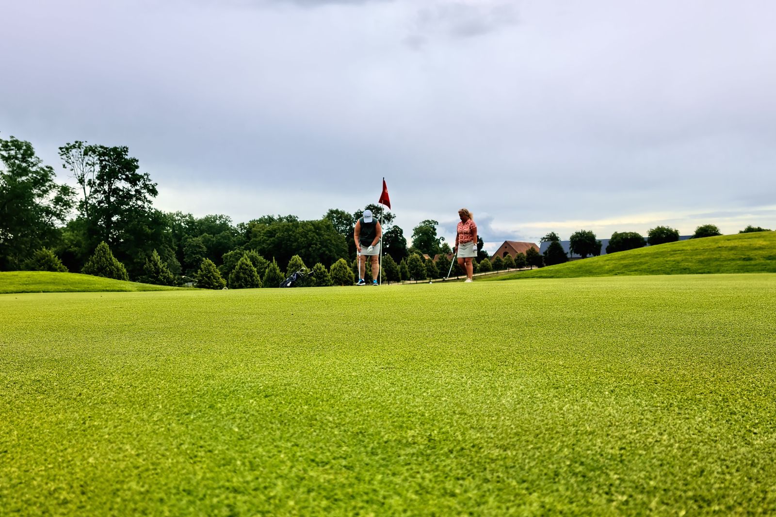 A group of friends on a golf course on the morning of a stag day