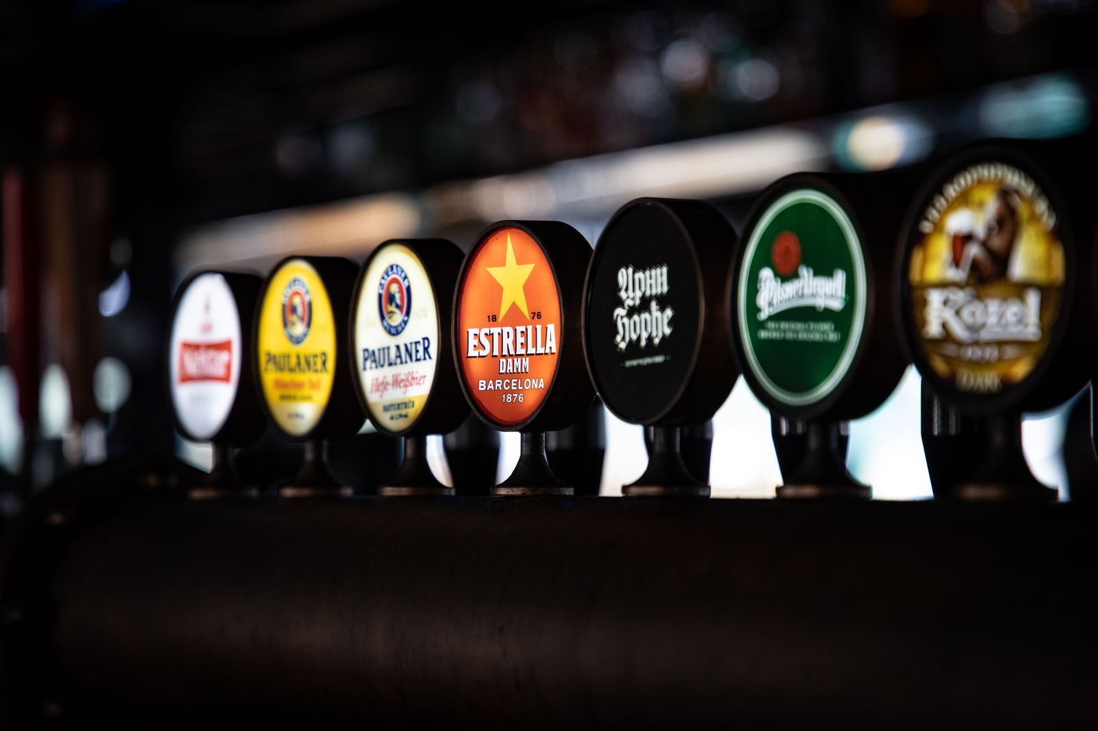 A flight of craft beers on a bar at a Hamilton taproom