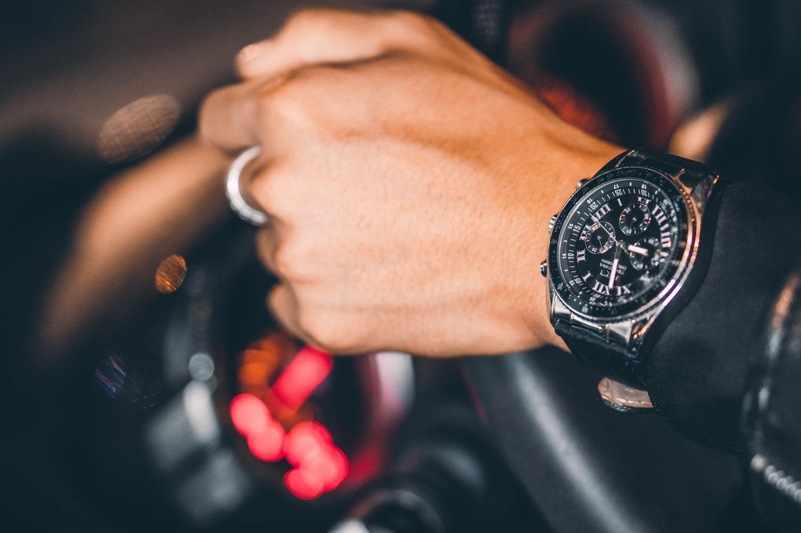 A chauffeur's watch and steering wheel: on an hourly booking, time is what you are buying