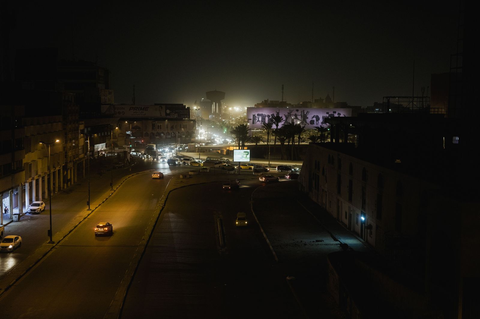 City lights at night seen through a car window