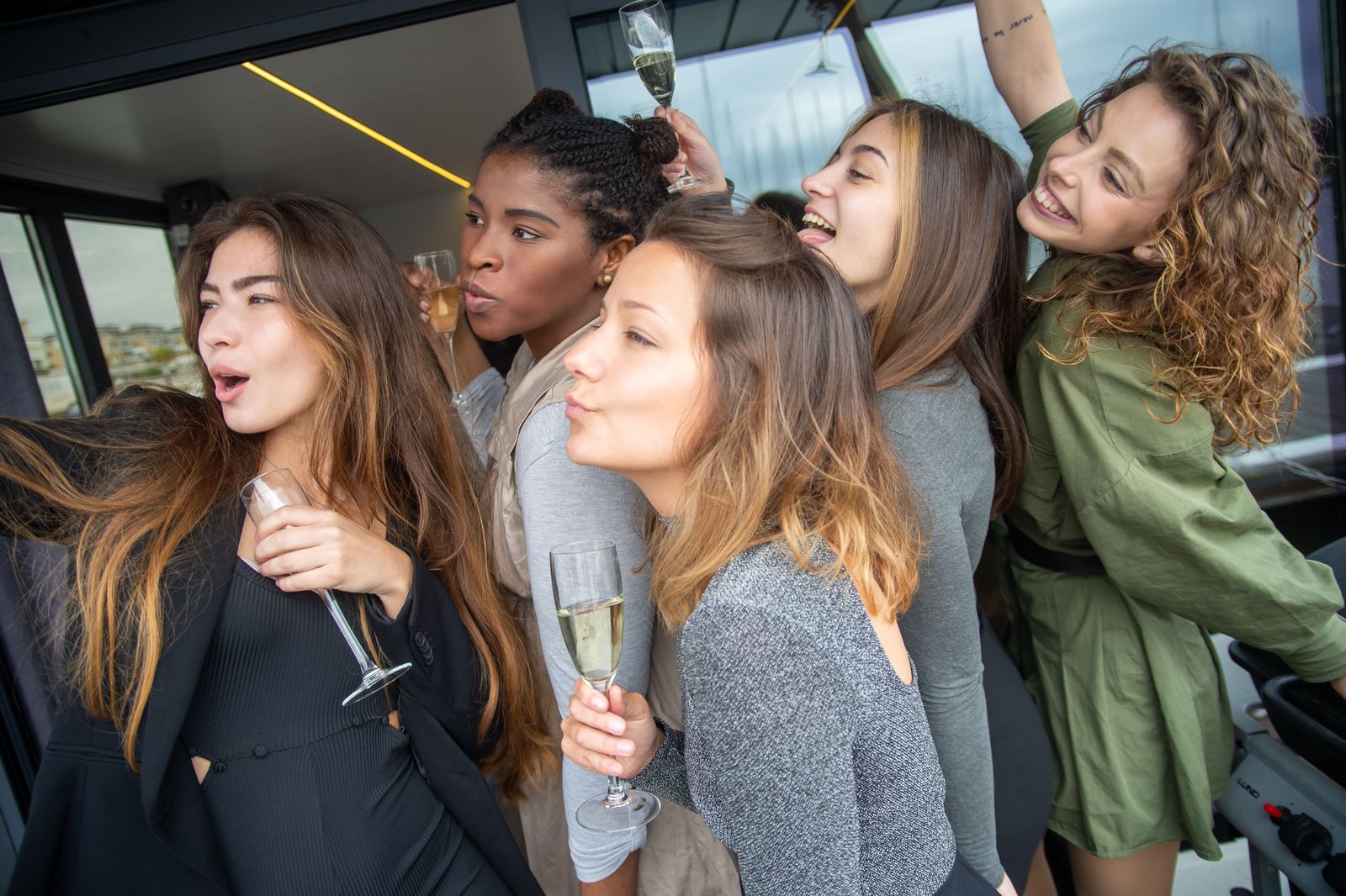 A group of friends celebrating inside a limousine on a night out