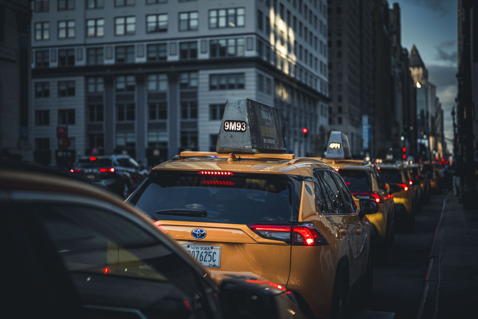 A line of taxis waiting at an airport taxi rank