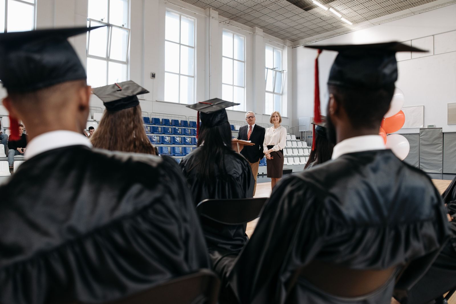 The audience in a concert hall during a university convocation ceremony