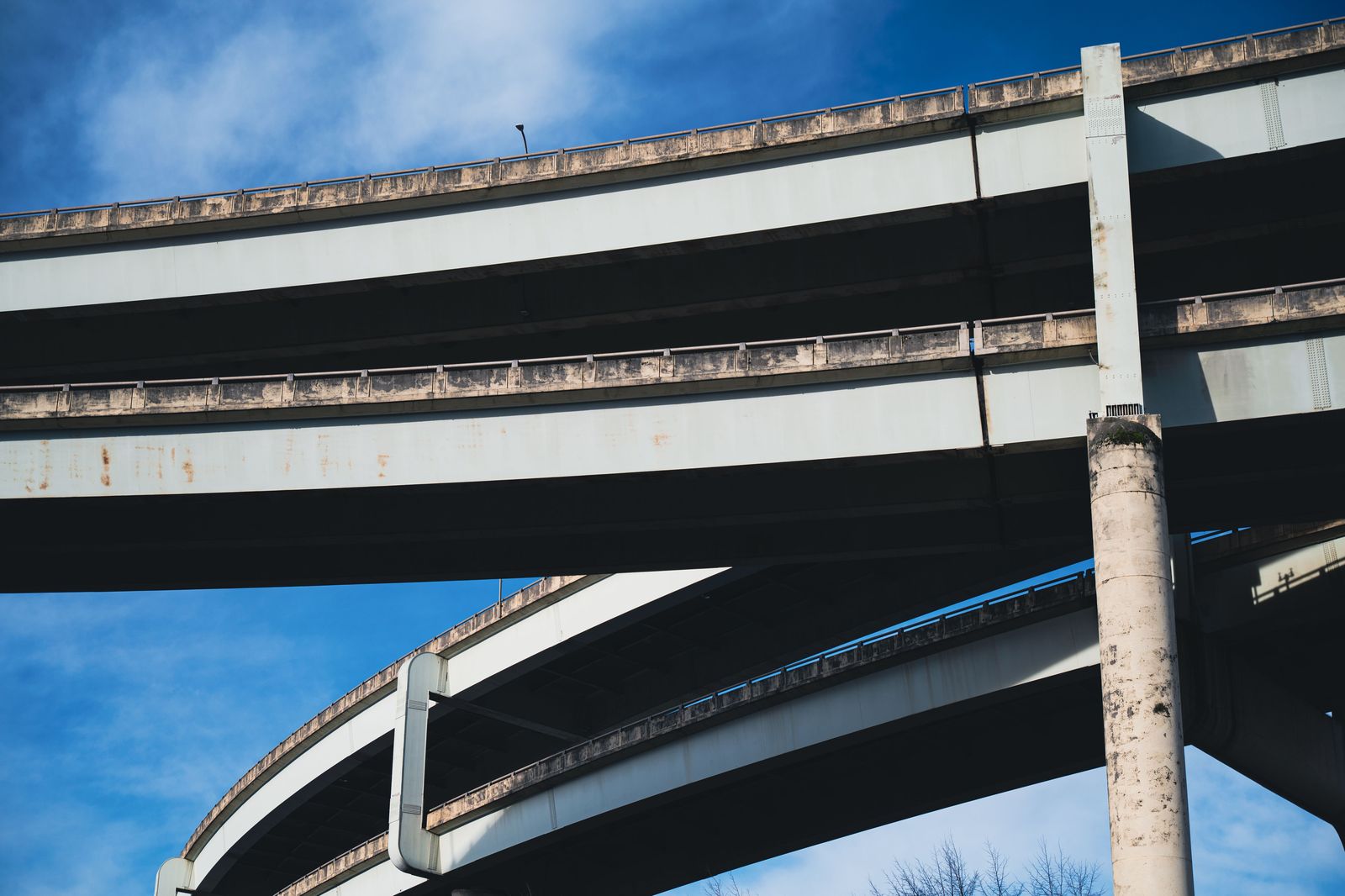 A toll highway overpass with light traffic in the morning
