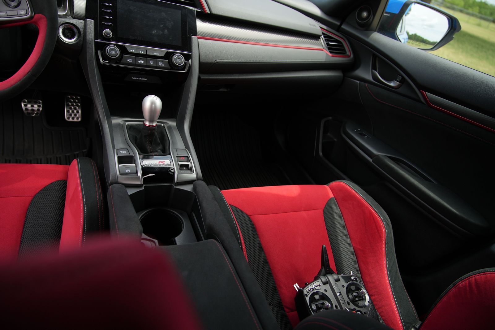 Child booster seat fitted in the back seat of a chauffeured car