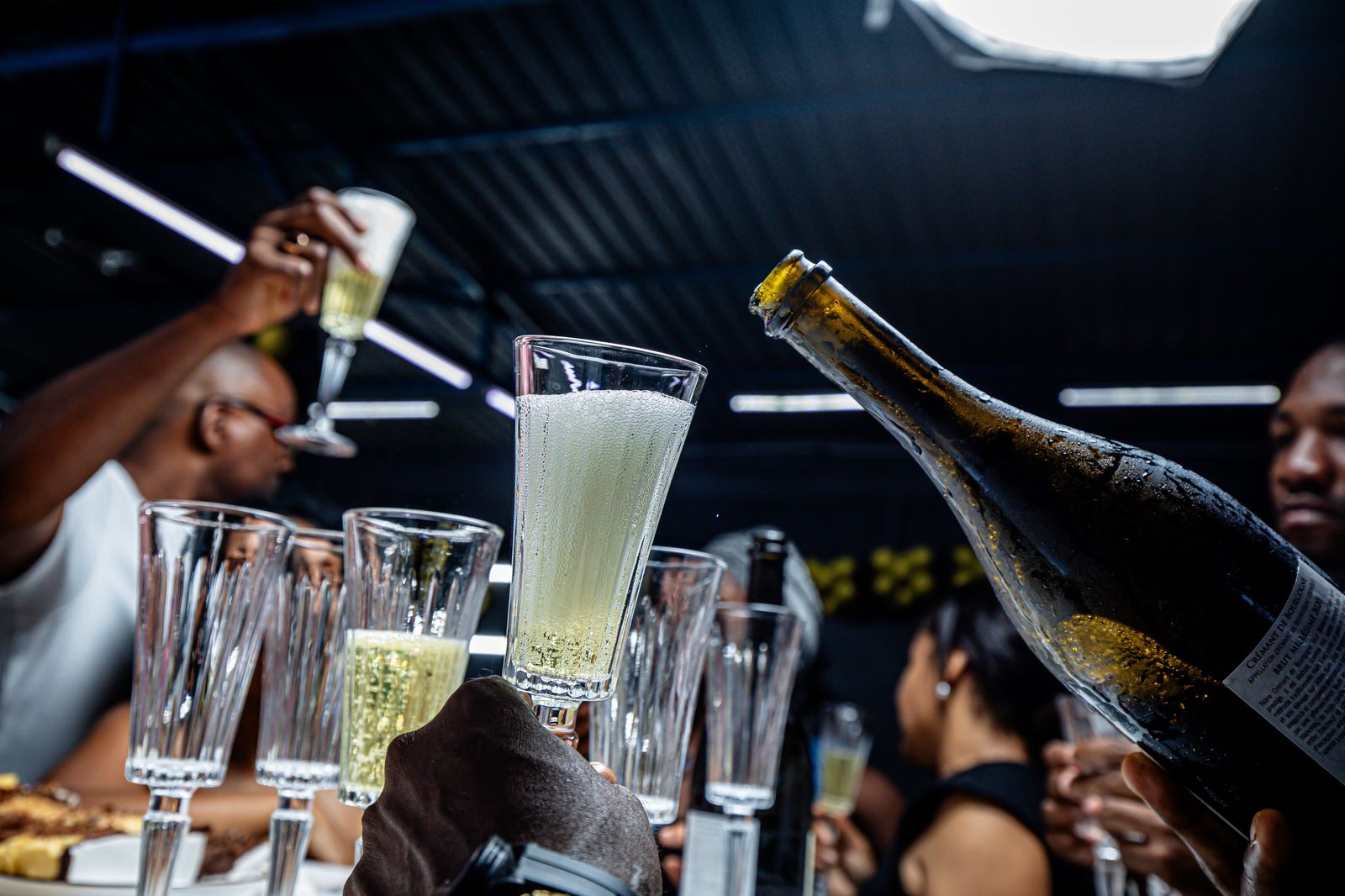 Friends toasting with champagne at a New Year's Eve party