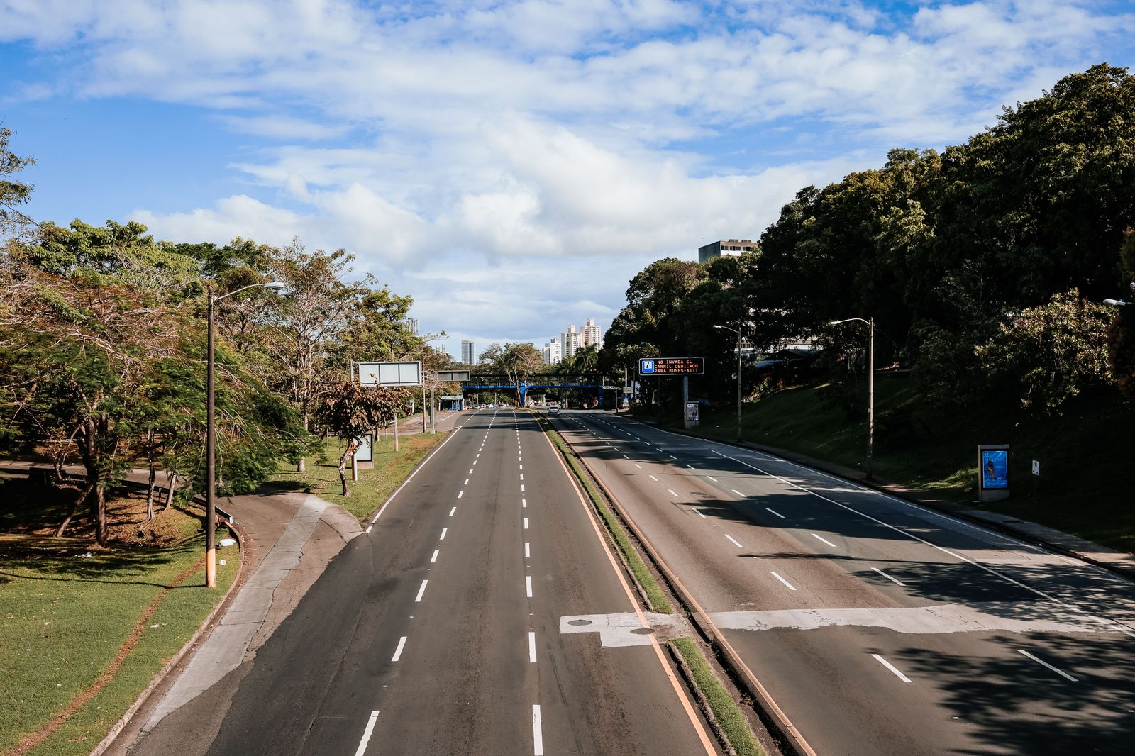 An empty dedicated lane leads to the inspection booths at a land border crossing