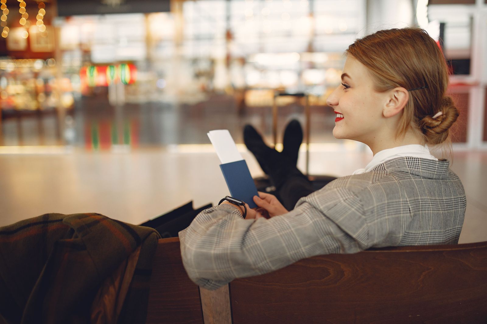 A business traveller uses an airport kiosk, one of the other benefits of a trusted-traveller card