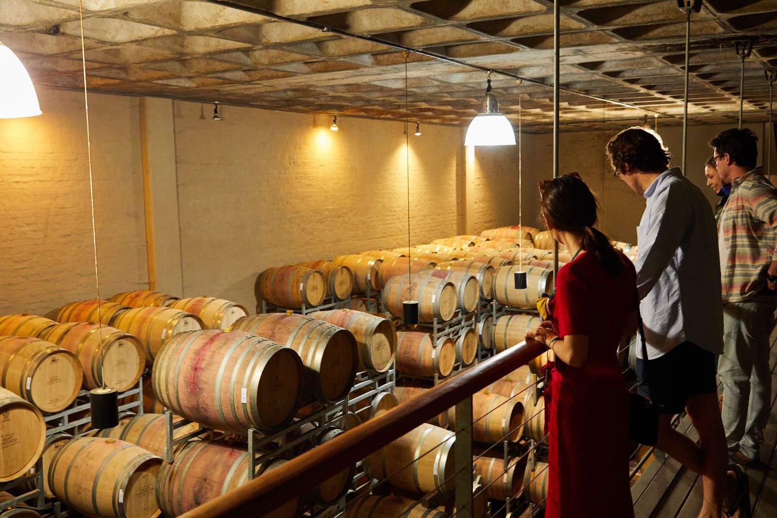 Wine glasses lined up for a tasting in a Niagara winery barrel room