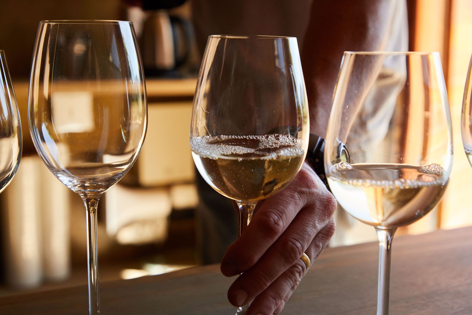 A flight of wine glasses laid out for a tasting at a Niagara winery bar