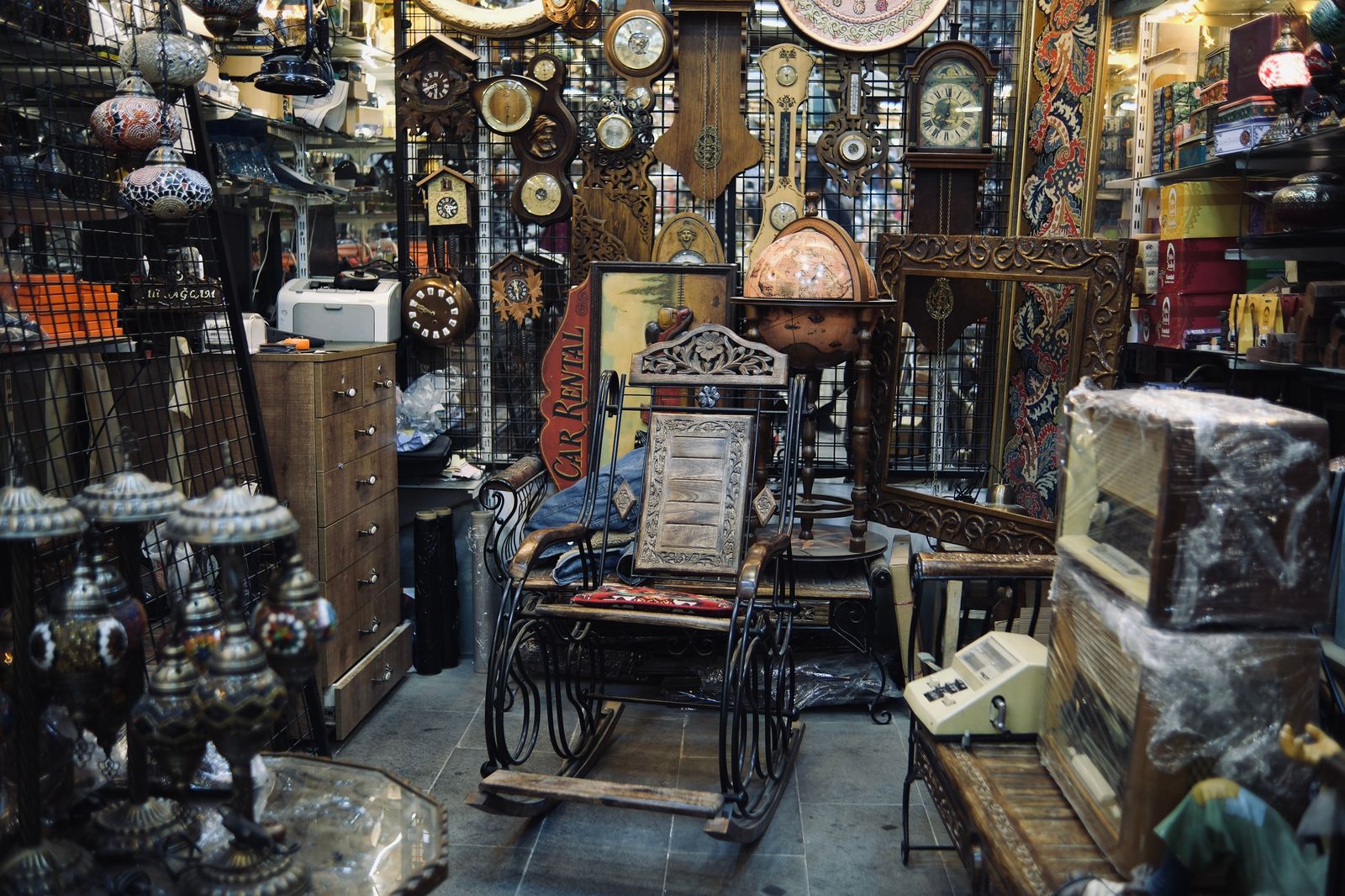 An antique shop interior with vintage furniture; the car waits while you browse and loads what fits safely.