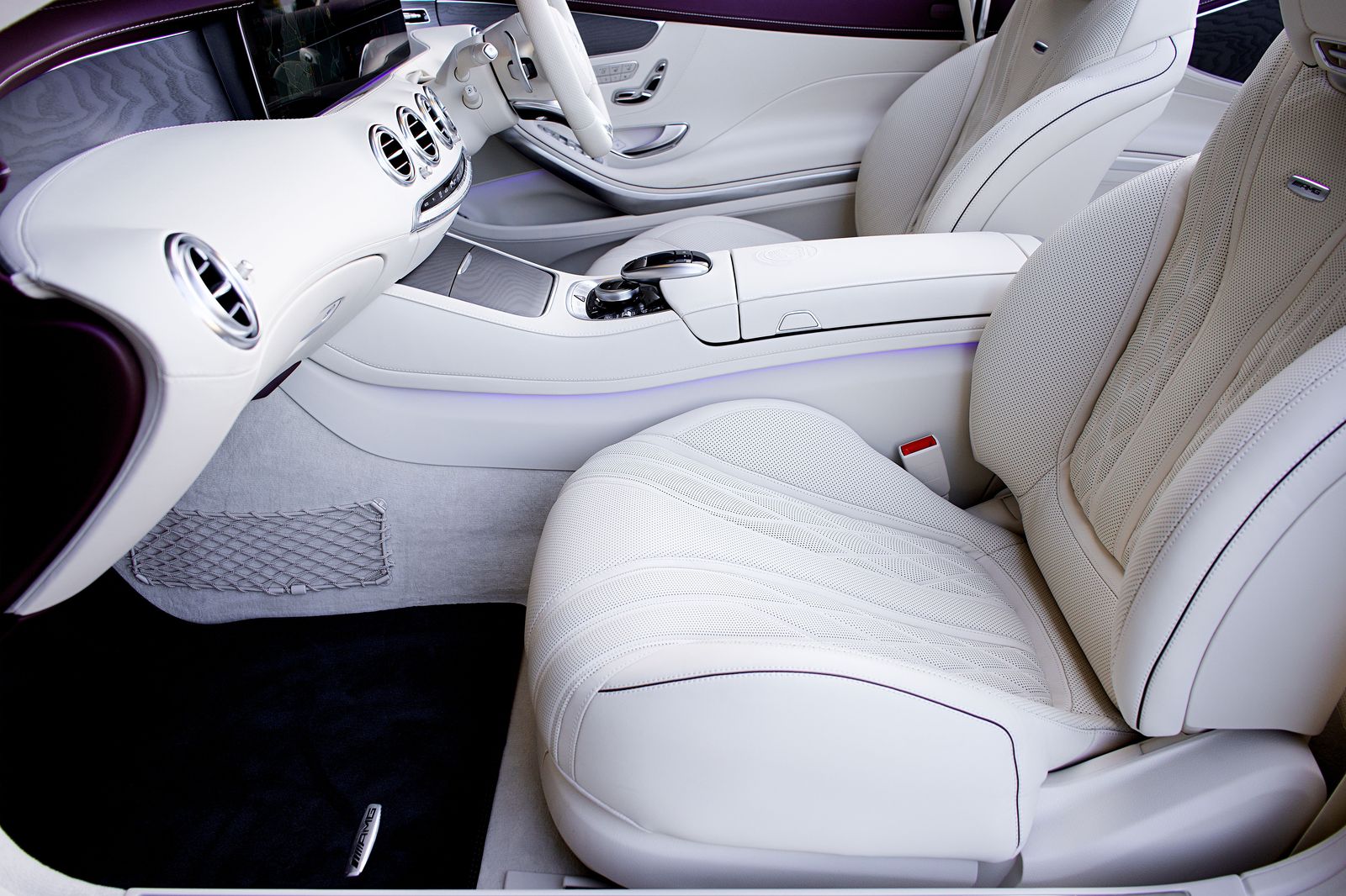 The leather side benches inside a stretch limousine, where everyone faces each other across a narrow cabin