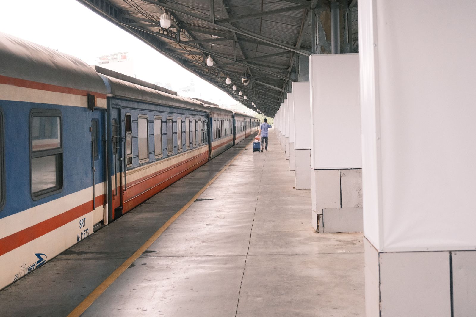 A passenger train passes a station platform in upstate New York