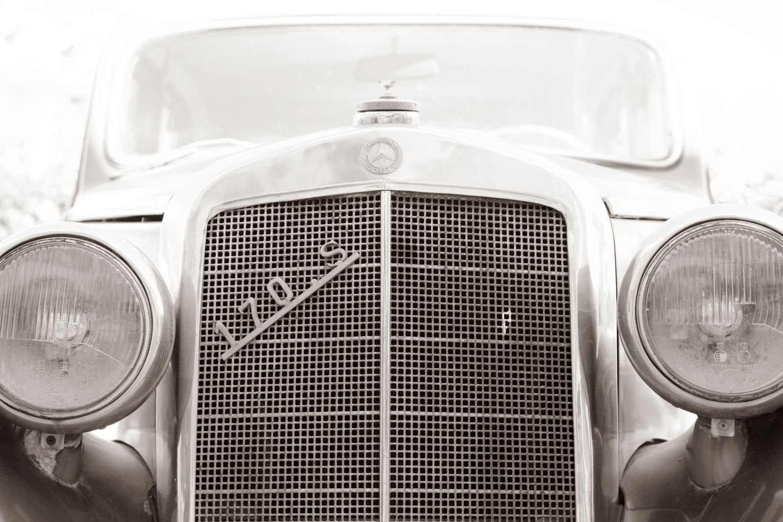 The front of a luxury chauffeured car polished for a wedding, the view most photographers want