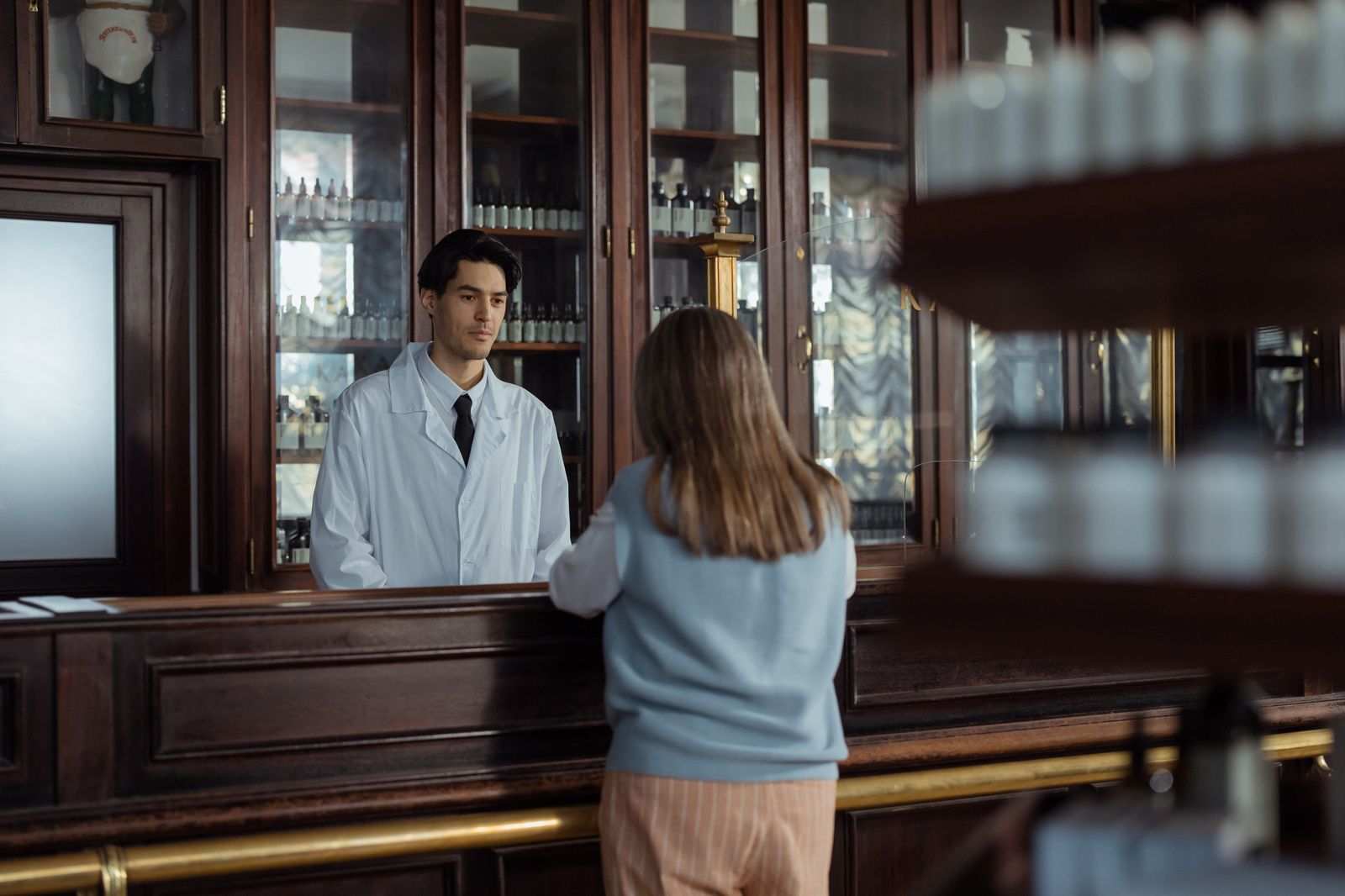 A pharmacy counter with a prescription bag, a regular stop on a weekly errand run