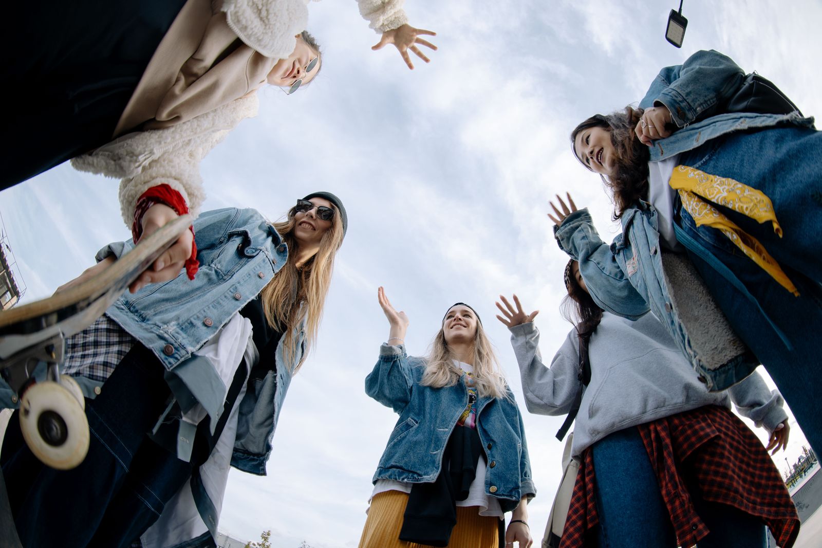 A group of friends stepping aboard a black passenger van for a day out