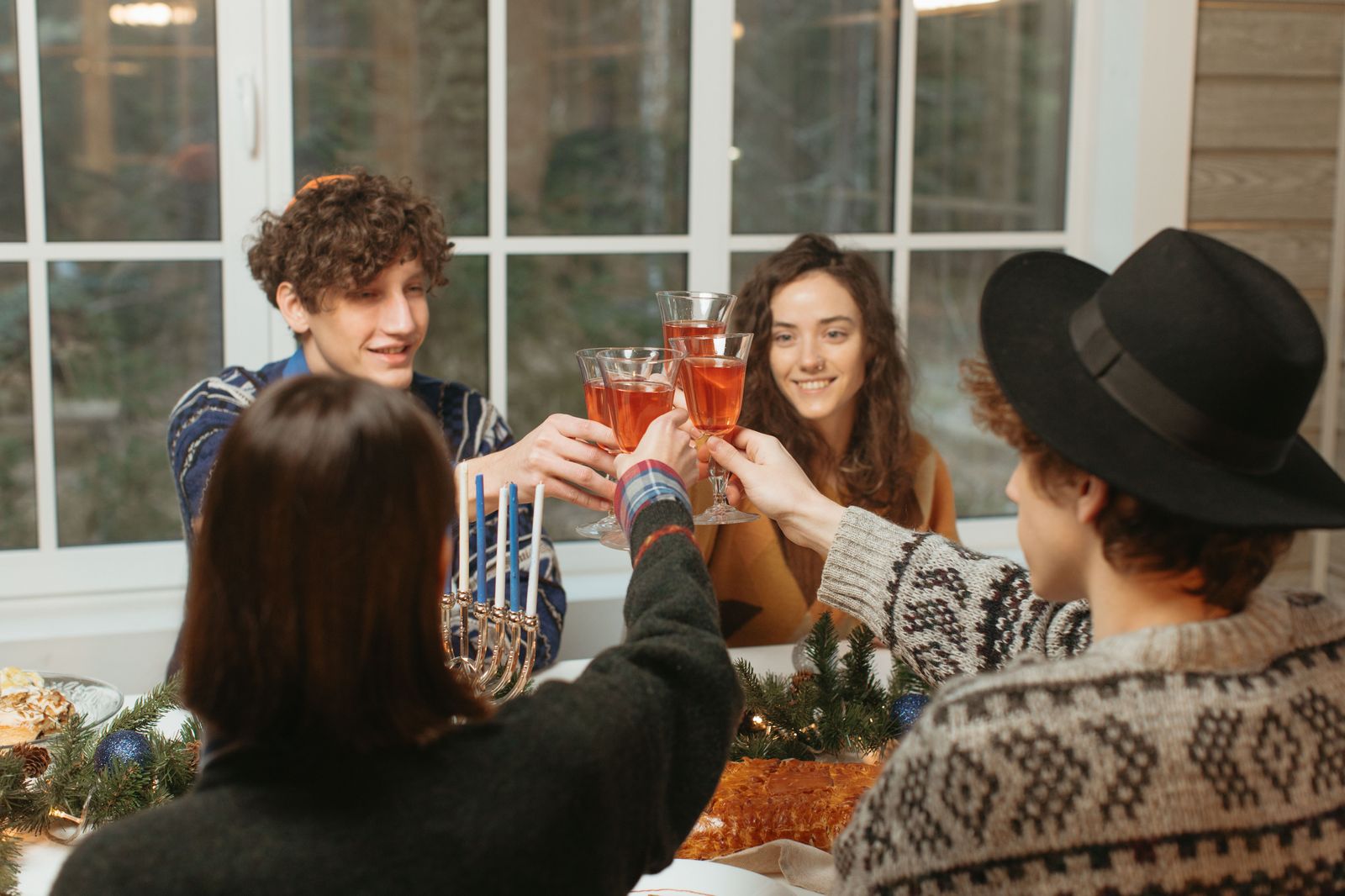 Colleagues raising glasses at a holiday dinner