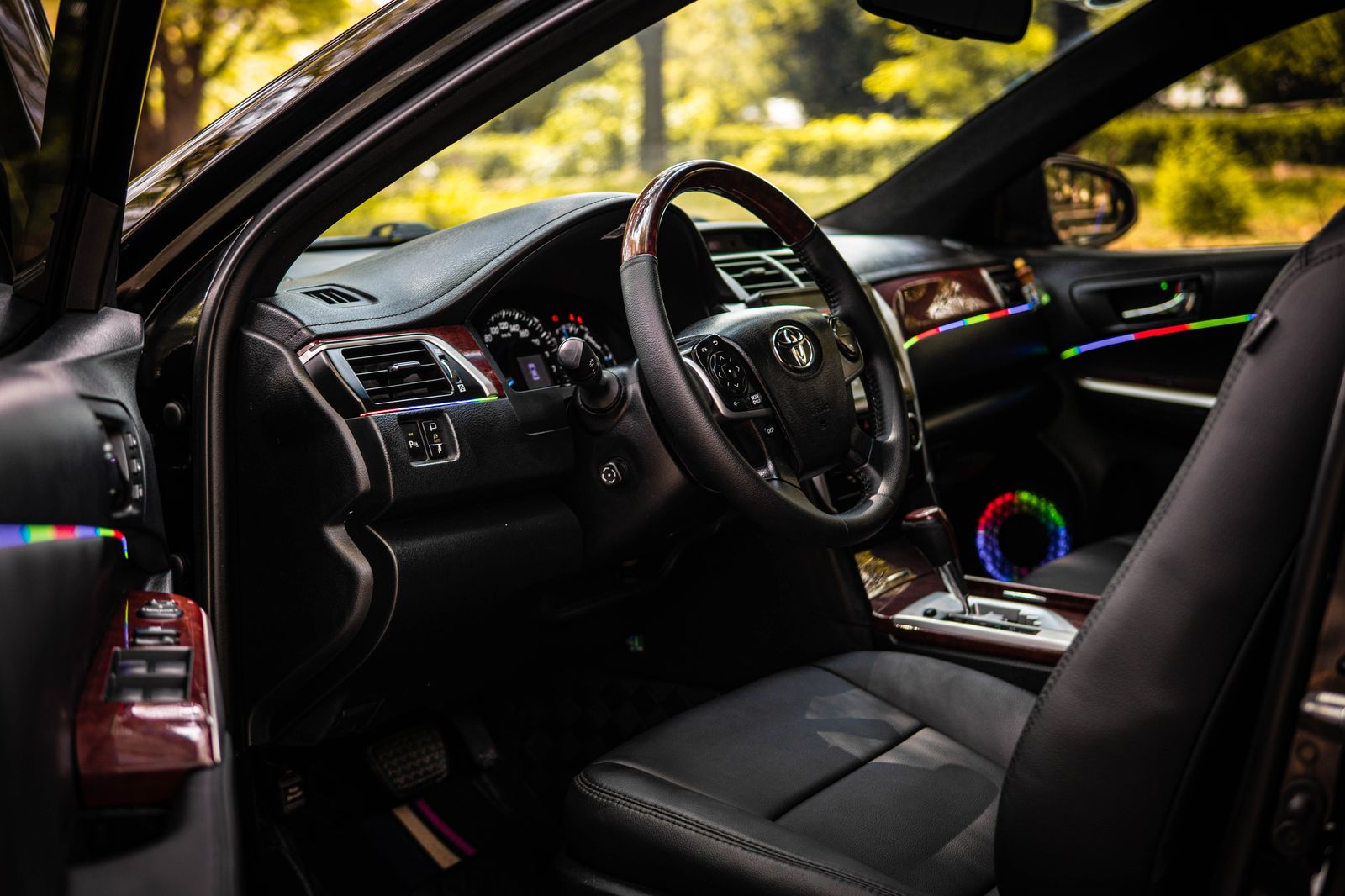 The interior of a stretch limousine with leather seats and lights