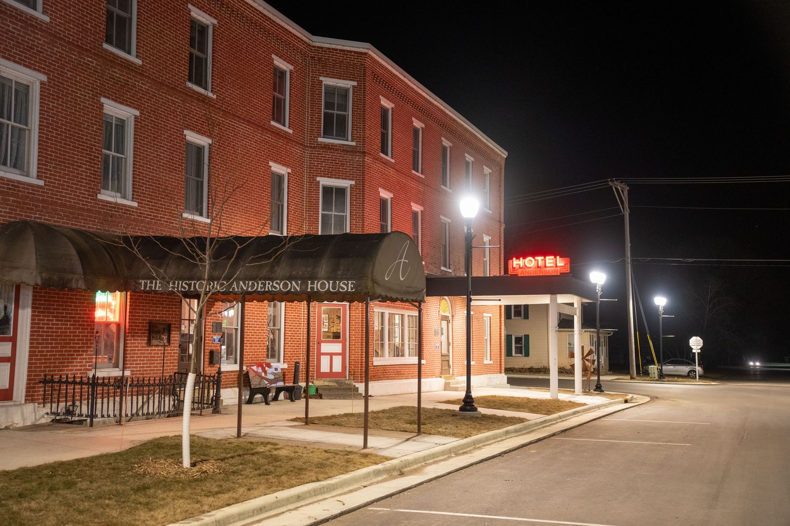A downtown hotel entrance on a busy evening before a show at the arena