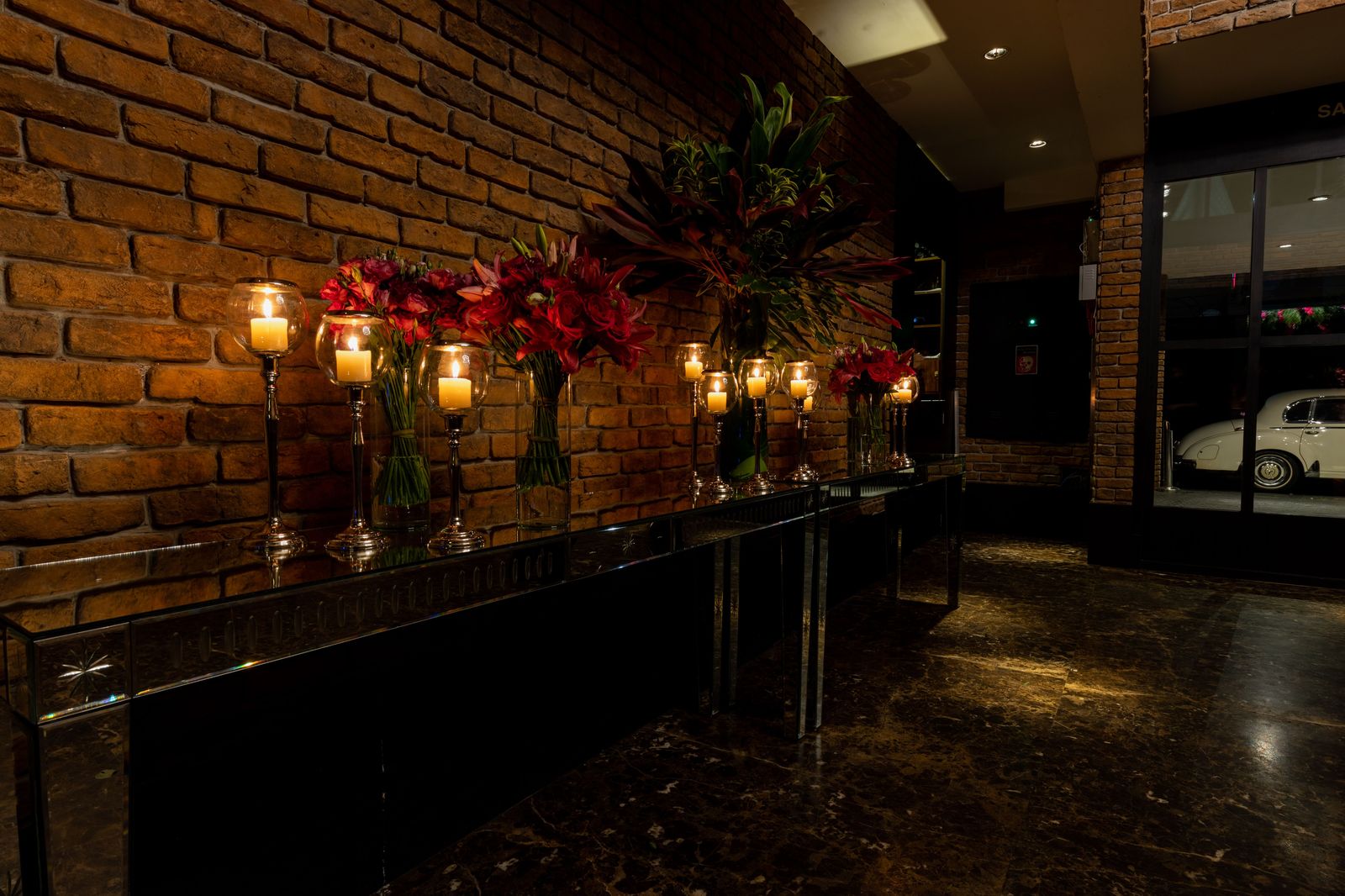 A hotel entrance at night where a guest shuttle collects wedding guests after the reception