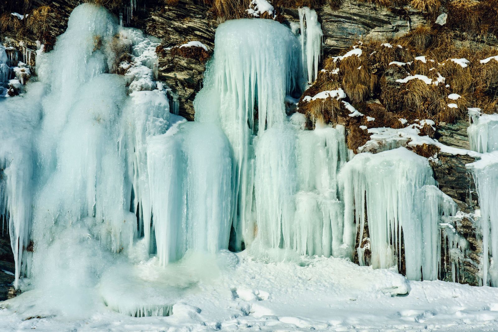 Frozen waterfall covered in ice on a cold winter day