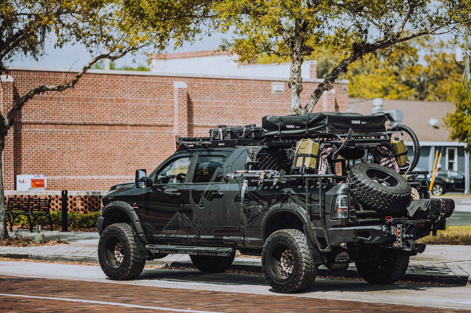 Luggage being loaded into a black SUV after a private arrival