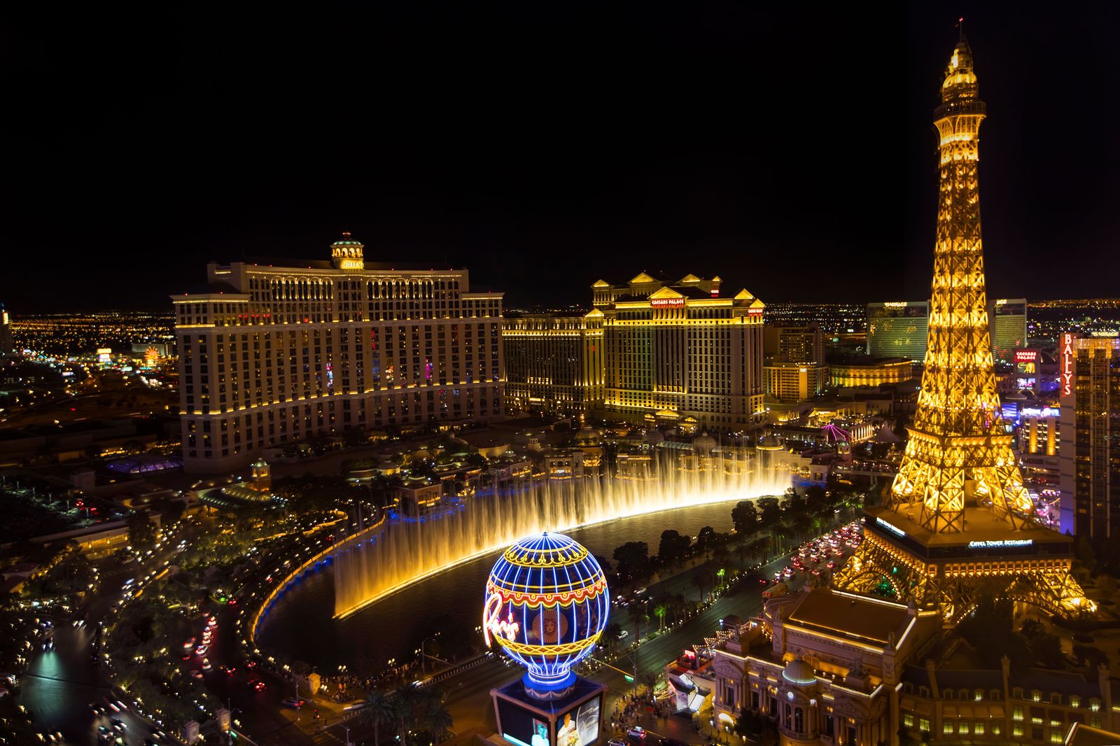 Casino and hotel towers lit up at night above the Falls, the start of many evening bookings.