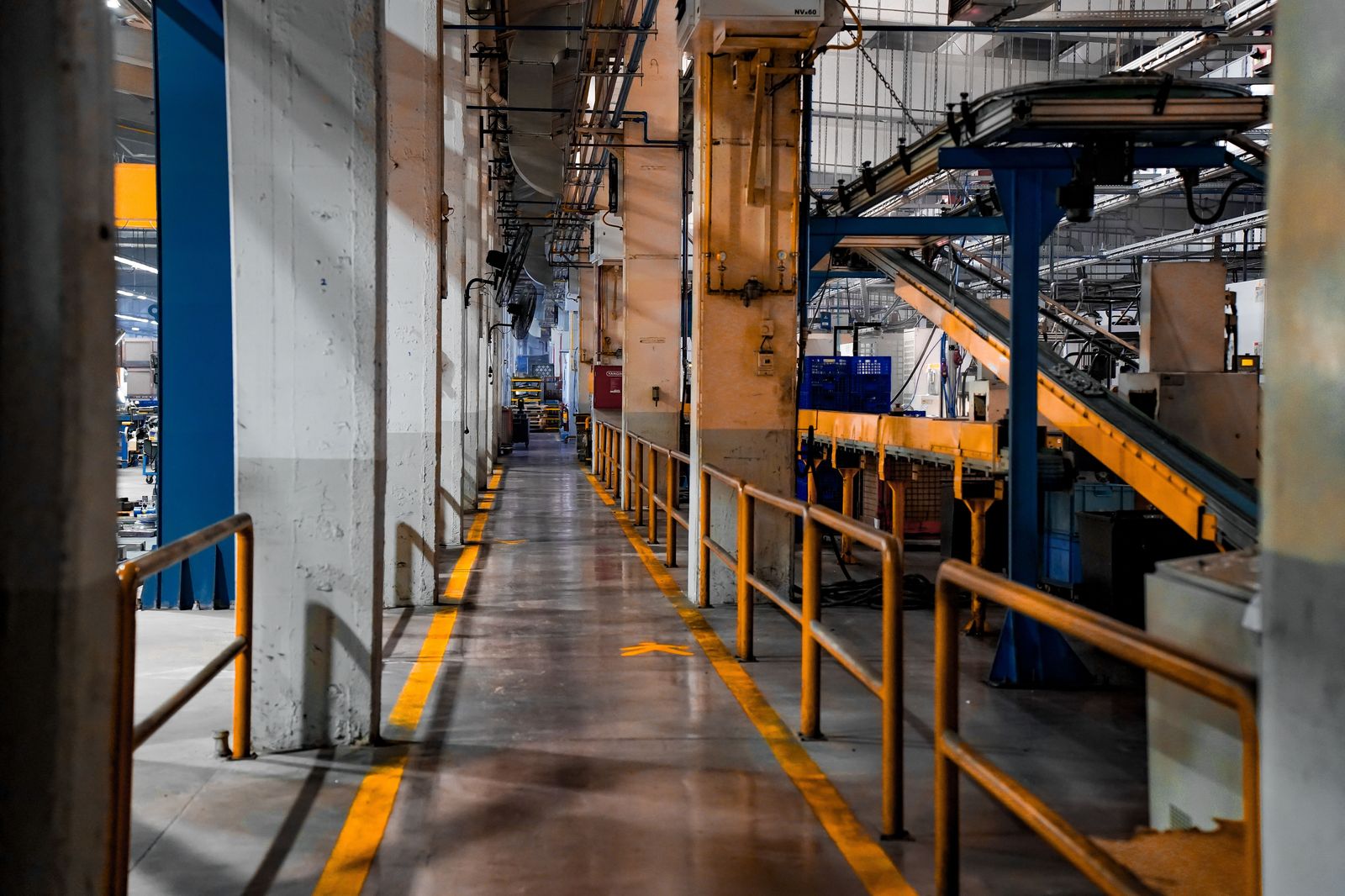 A car assembly line under bright lights, the kind of plant visit that fills Woodstock's weekday bookings.