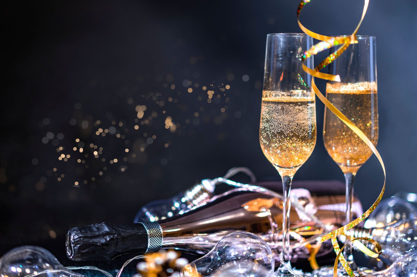 Friends raising champagne glasses at a New Year's Eve party