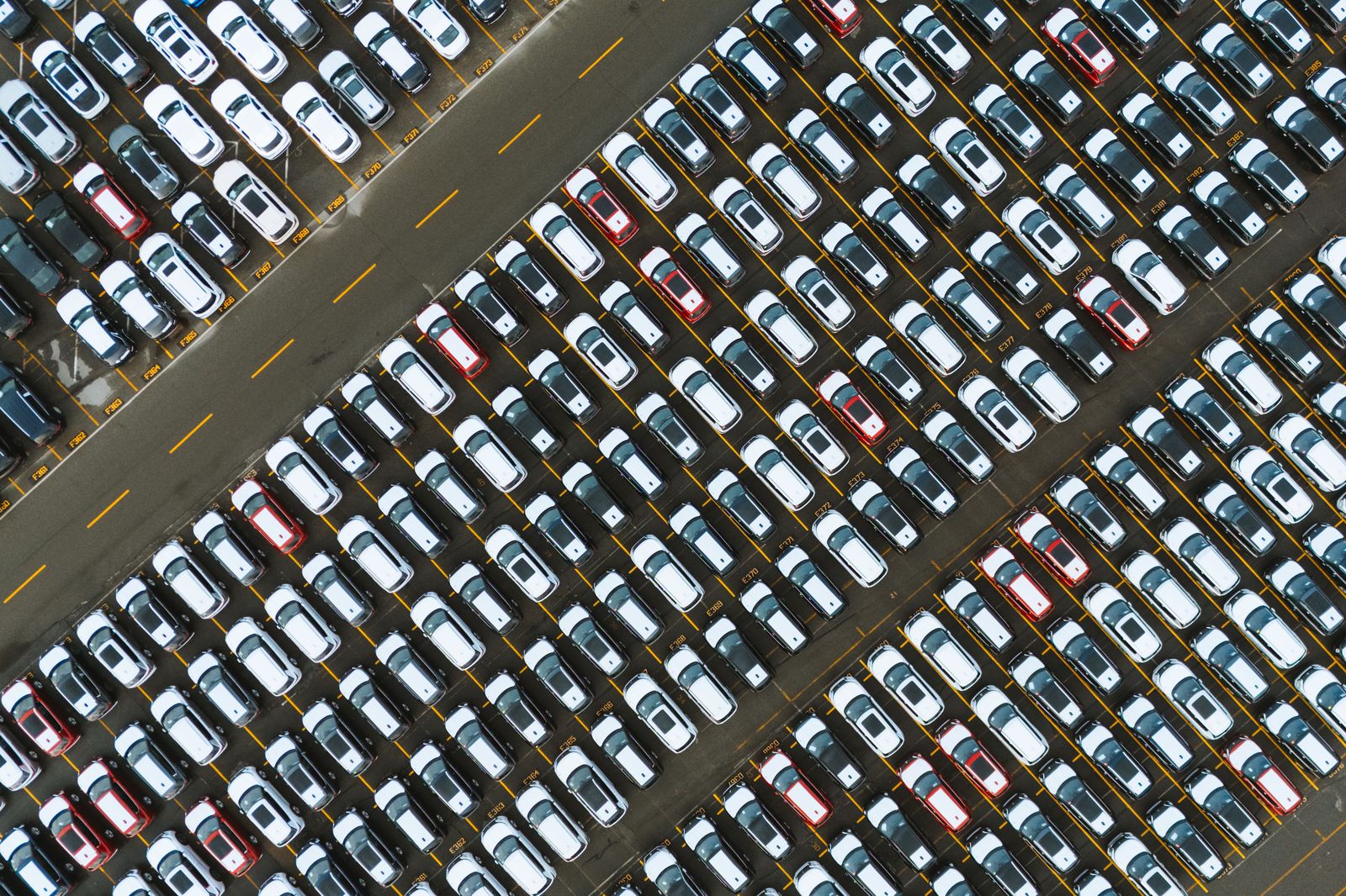 Rows of parked cars in an airport parking lot