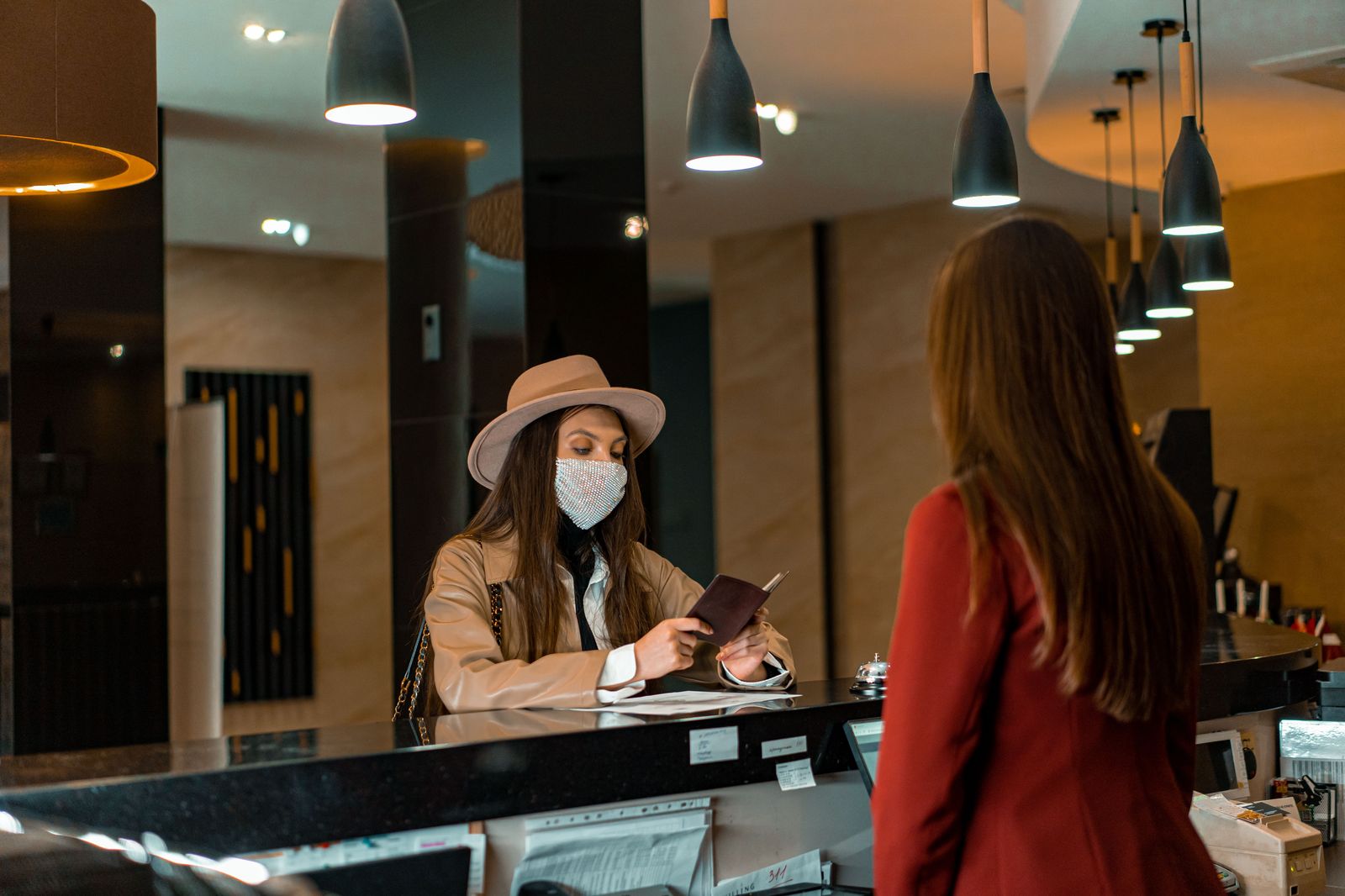 Business travellers in a hotel lobby waiting for a chauffeured car