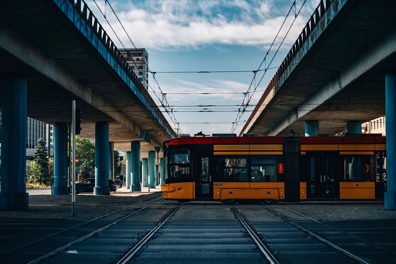 A light rail train on a downtown street in Kitchener-Waterloo, near the hotels on King Street