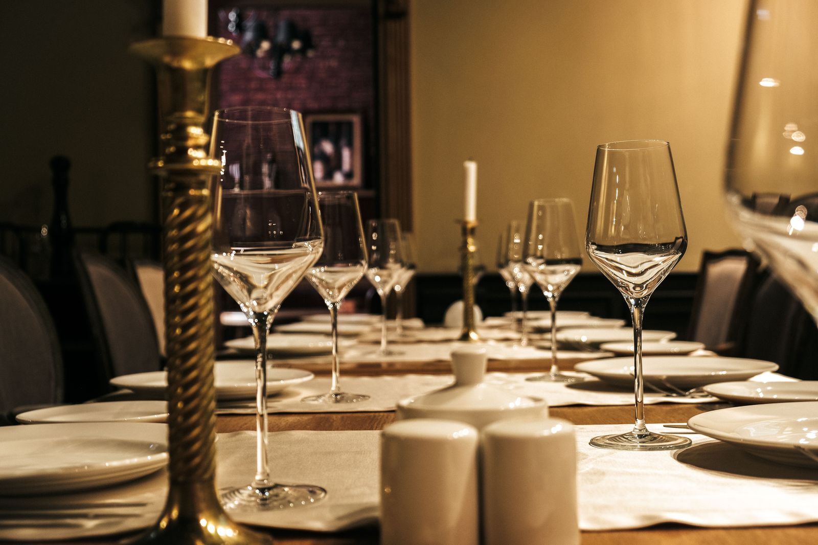 A candlelit restaurant table set for two on an anniversary evening